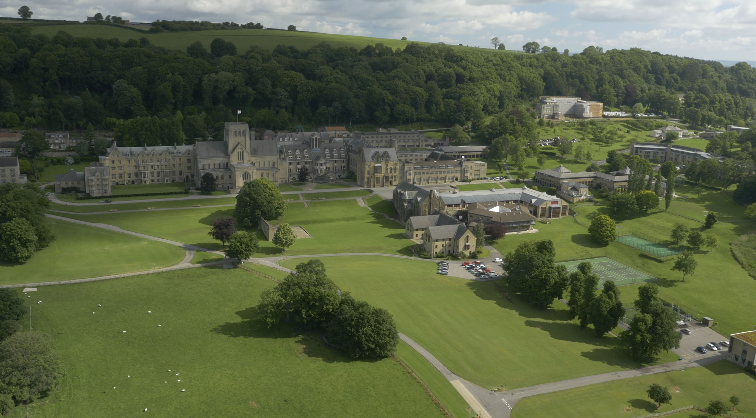 Aerial photograph of the Ampleforth estate and the grounds around it, including the carpark and tennis courts